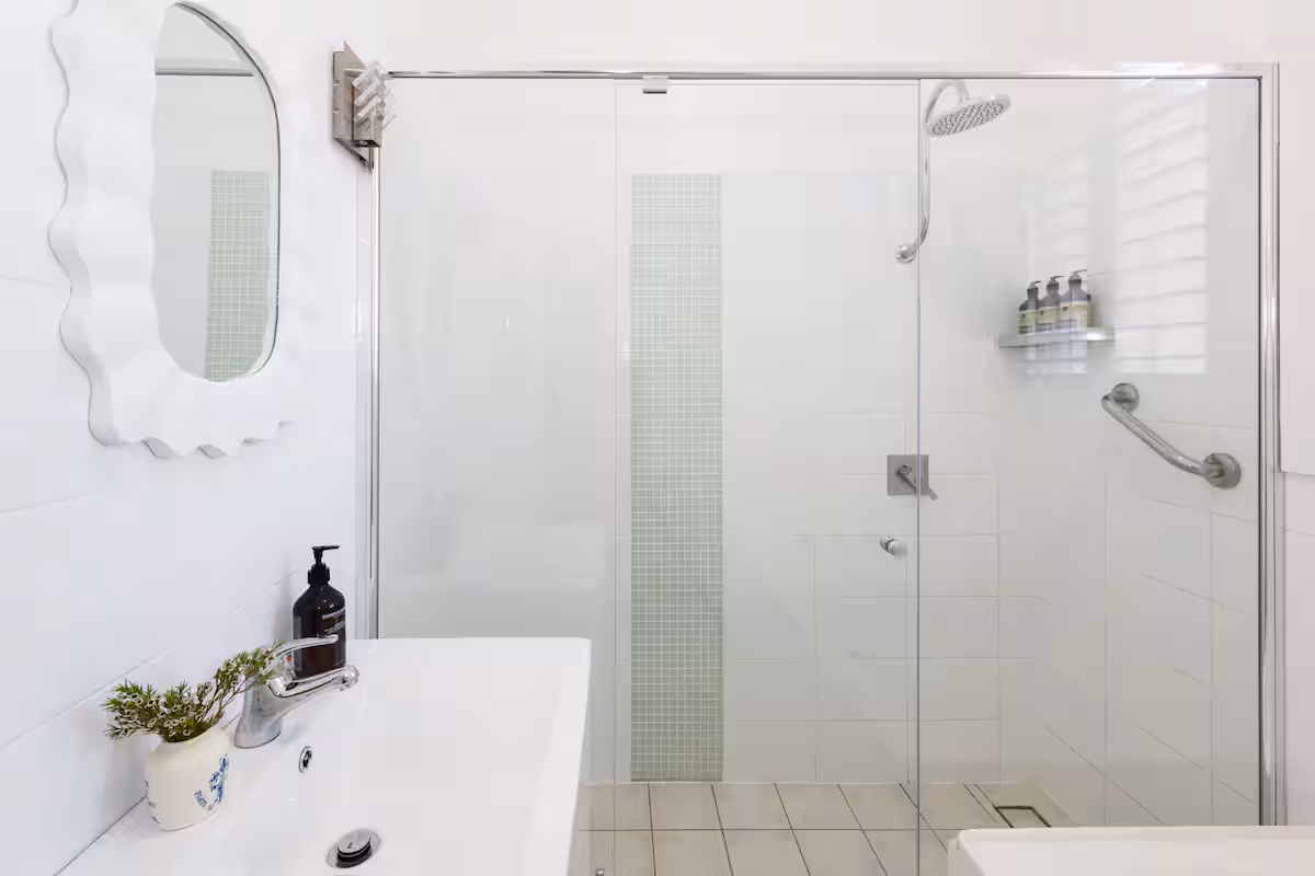 Primary bathroom with complimentary toiletries, shower and bathtub