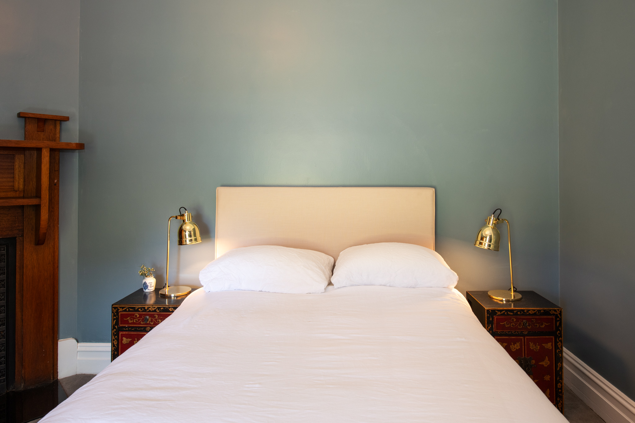 Bedroom with double bed and french doors leading to garden