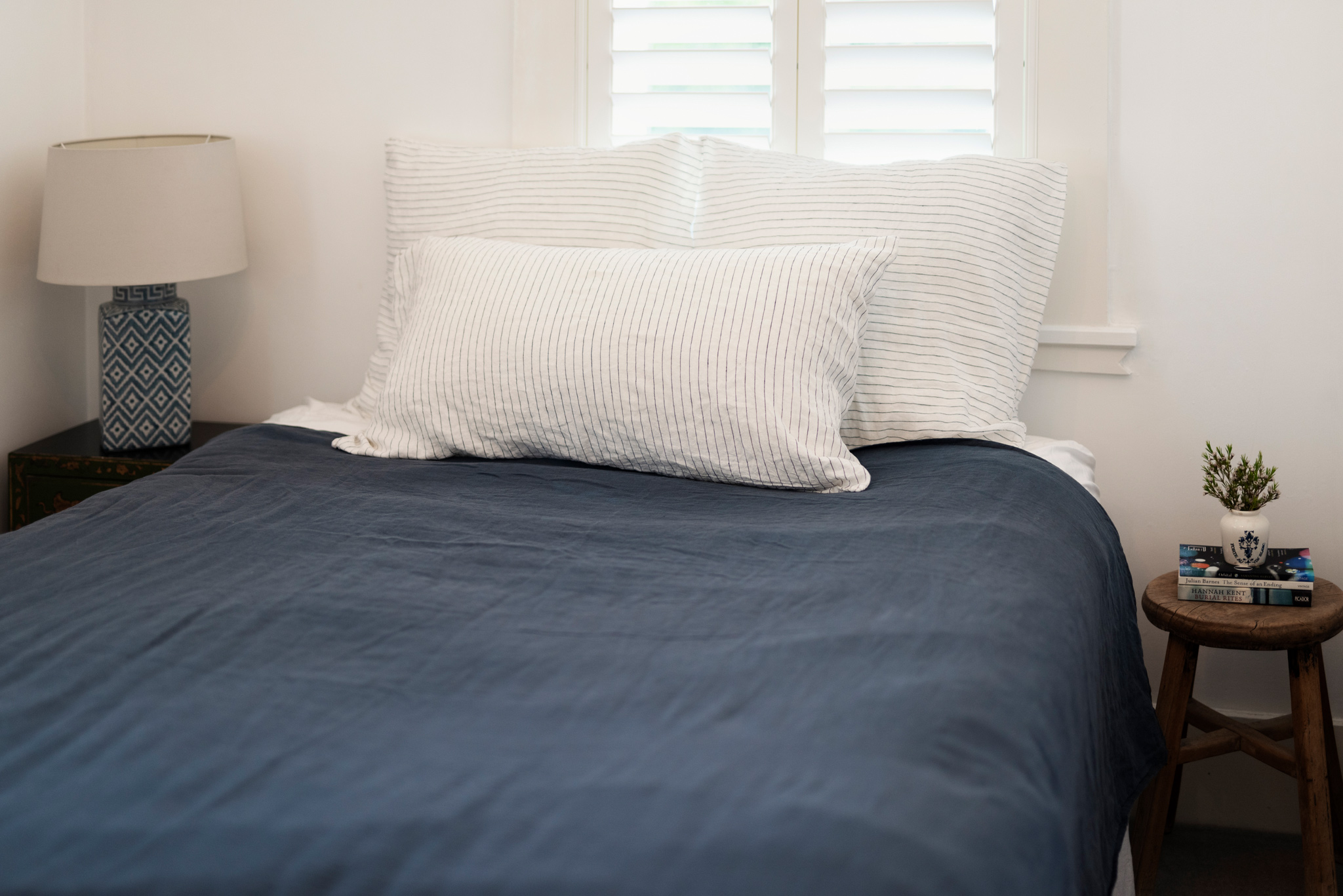 Upstairs bedroom with double bed and large window