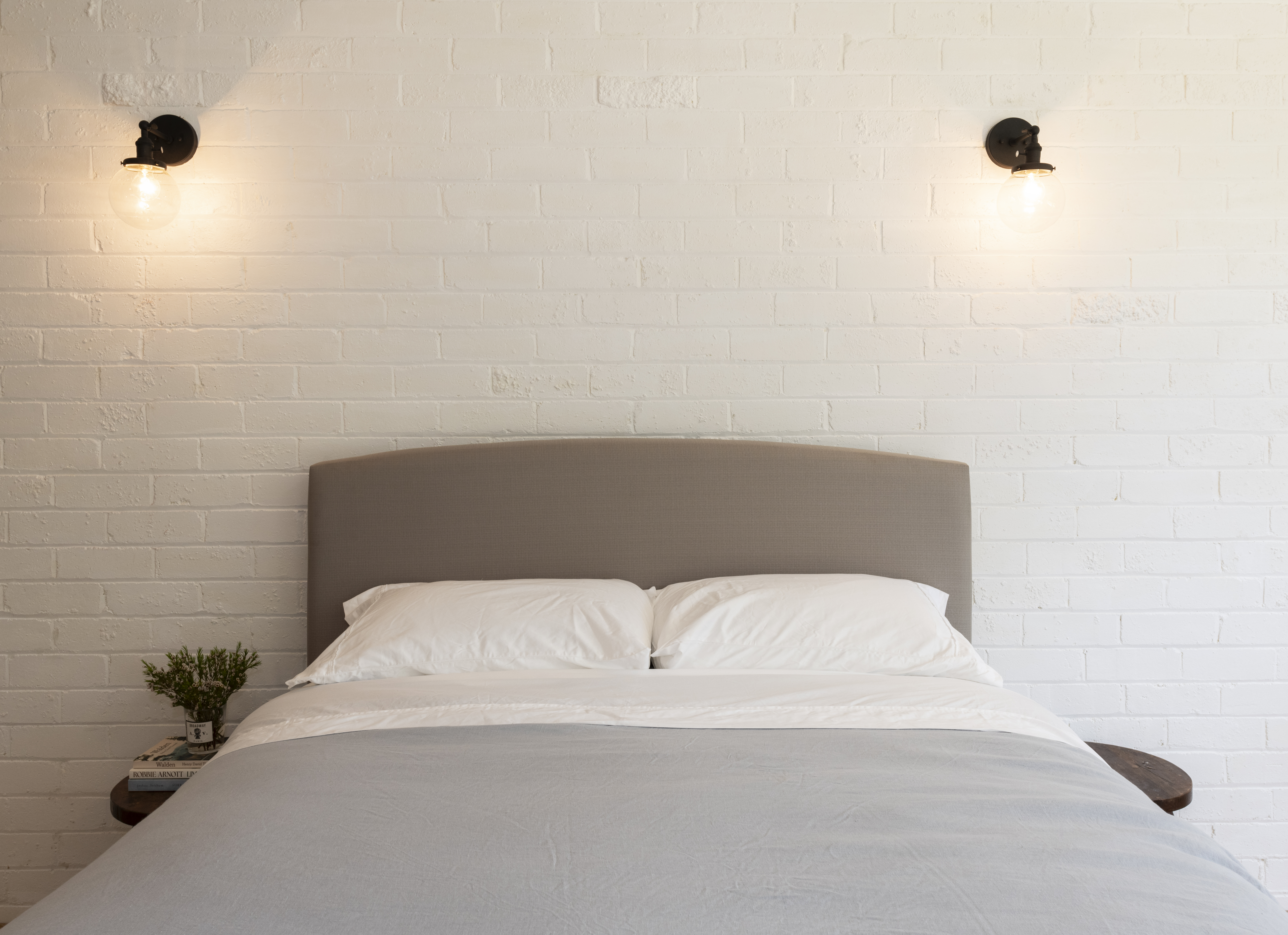 Downstairs bedroom with double bed and artwork