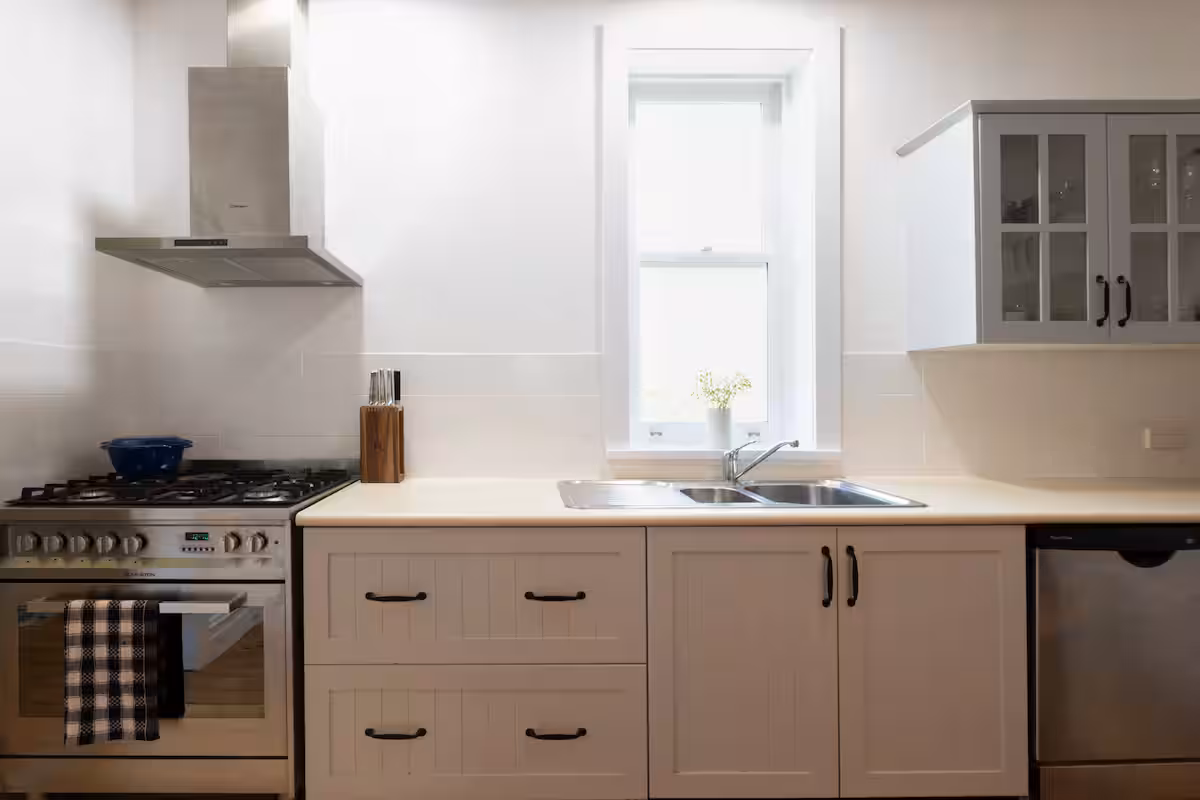 Eat-in kitchen with timber table, range and fireplace