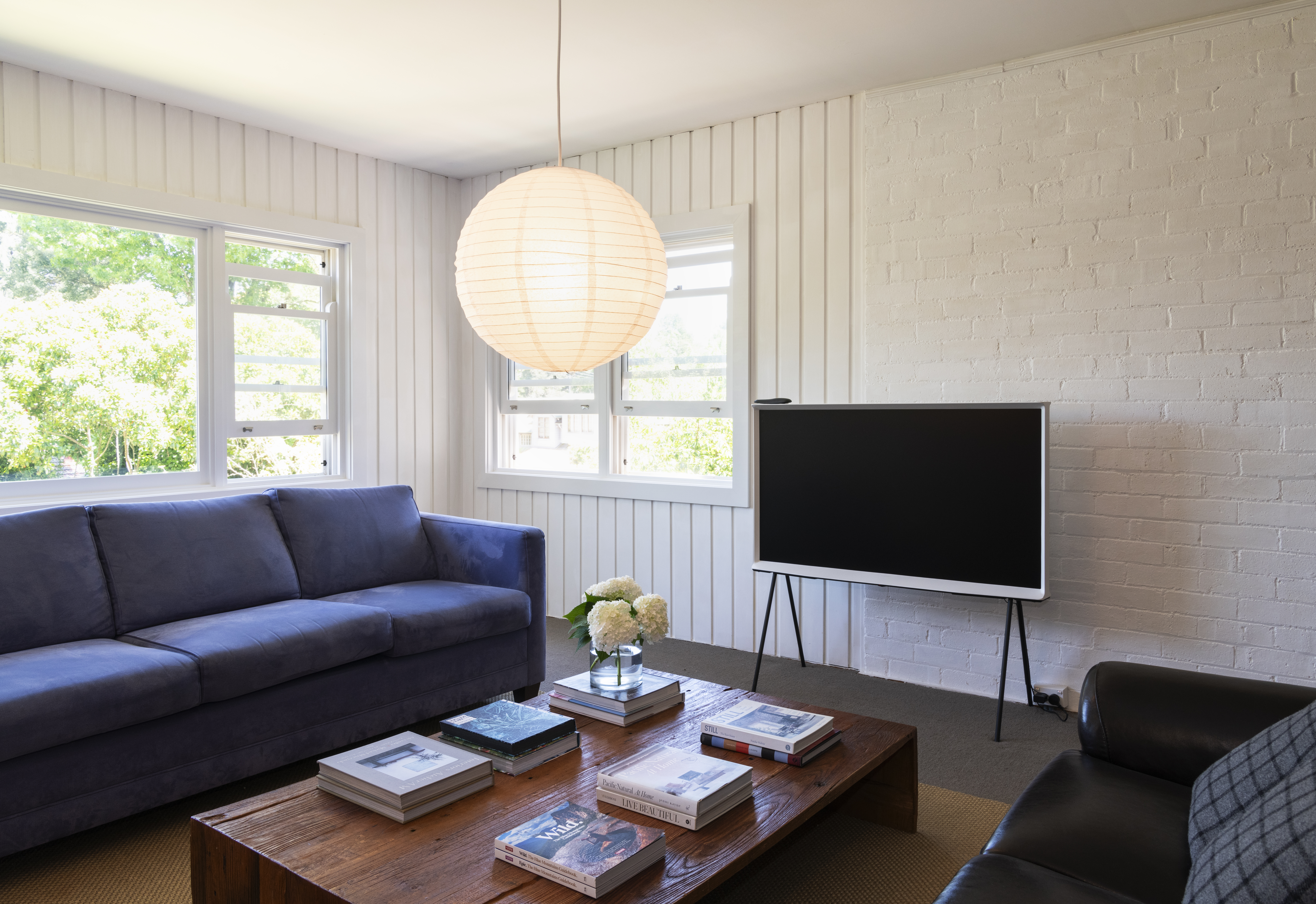 Casual family room with Serif TV and art